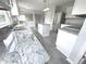 Modern kitchen boasts granite countertops and stainless steel appliances at 6558 Caressa Way, Indianapolis, IN 46259