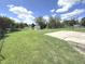 Large backyard with basketball court, shed, and pond at 6558 Caressa Way, Indianapolis, IN 46259