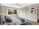 Bright bedroom with large window, closet, and ceiling fan at 3965 N Meridian St # 3B, Indianapolis, IN 46208