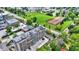 Aerial view of apartment building and tennis courts, showcasing the surrounding green space at 3965 N Meridian St # 3B, Indianapolis, IN 46208