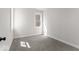 Bright bedroom with gray carpet and a window at 248 N Walcott N St, Indianapolis, IN 46201