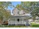 Renovated two-story home with a front porch at 248 N Walcott N St, Indianapolis, IN 46201