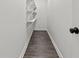Walk-in pantry with ample shelving and wood-look flooring at 248 N Walcott N St, Indianapolis, IN 46201