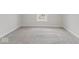 Spacious bedroom with grey carpeting and a window at 248 N Walcott N St, Indianapolis, IN 46201