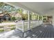 Spacious front porch with gray decking and white railings at 248 N Walcott N St, Indianapolis, IN 46201