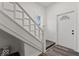 White staircase with a classic spindle railing at 248 N Walcott N St, Indianapolis, IN 46201