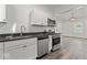Modern kitchen featuring stainless steel appliances and dark granite countertops at 248 N Walcott N St, Indianapolis, IN 46201
