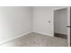 Simple bedroom with gray carpet and an adjacent closet at 248 N Walcott N St, Indianapolis, IN 46201