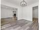 Open concept dining room with hardwood floors and chandelier at 248 N Walcott N St, Indianapolis, IN 46201