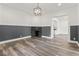 Open living room with views into kitchen and upstairs at 248 N Walcott N St, Indianapolis, IN 46201