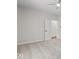 Spacious bedroom with gray carpeting and an open door to another room at 248 N Walcott N St, Indianapolis, IN 46201