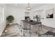 Virtually staged dining room, featuring a large table and hardwood floors at 248 N Walcott N St, Indianapolis, IN 46201