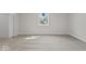 Well-lit bedroom with gray carpet, a window, and ample space at 248 N Walcott N St, Indianapolis, IN 46201