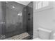 Large dark-tiled shower with hexagonal floor tiles at 248 N Walcott N St, Indianapolis, IN 46201