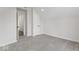 Bright bedroom featuring grey carpeting and access to hallway at 248 N Walcott N St, Indianapolis, IN 46201