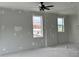 Unfinished bedroom with new windows and ceiling fan at 150 S Main St # 303, Franklin, IN 46131
