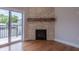 Modern fireplace with stone facade and reclaimed wood mantel at 150 S Main St # 303, Franklin, IN 46131