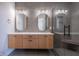 Elegant bathroom with double vanity, oval mirrors, and a walk-in shower at 150 S Main St # 303, Franklin, IN 46131
