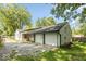 View of two-car garage and backyard at 3649 N Sadlier Dr, Indianapolis, IN 46226