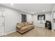 Bright living room with wood-look floors and a comfortable sofa at 3649 N Sadlier Dr, Indianapolis, IN 46226