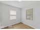 Small bedroom with two windows at 3649 N Sadlier Dr, Indianapolis, IN 46226