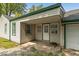 Home's back patio with access door and window at 3649 N Sadlier Dr, Indianapolis, IN 46226