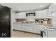 Bright eat-in kitchen with white cabinets and tile backsplash at 3649 N Sadlier Dr, Indianapolis, IN 46226