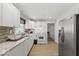 Modern kitchen with white cabinets and granite countertops at 3649 N Sadlier Dr, Indianapolis, IN 46226