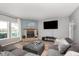 Living room with a stone fireplace and comfortable seating at 5427 Skipping Stone Dr, Indianapolis, IN 46237