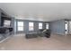 Large living room with gray walls and plush seating at 5427 Skipping Stone Dr, Indianapolis, IN 46237