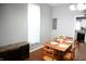 Dining area with a wood table, four chairs, and a view of the kitchen at 25 E Caven St, Indianapolis, IN 46225