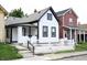 White house with black accents and a white picket fence at 25 E Caven St, Indianapolis, IN 46225