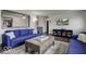 Open living room with blue sofas, wood floors, and a view at 17128 Towne Rd, Westfield, IN 46074