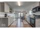 Modern kitchen with granite countertops, stainless steel appliances, and gray cabinets at 17128 Towne Rd, Westfield, IN 46074