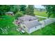 Aerial view showcasing house, deck, detached garage, and basketball hoop at 17128 Towne Rd, Westfield, IN 46074