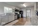 Gray cabinets, granite counters, and stainless steel appliances in this updated kitchen at 17128 Towne Rd, Westfield, IN 46074