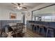 Modern dining area with a large table and bar seating at 17128 Towne Rd, Westfield, IN 46074