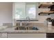 Modern kitchen sink and granite countertop with a window at 17128 Towne Rd, Westfield, IN 46074