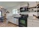 Modern kitchen features stainless steel appliances and gray cabinets at 17128 Towne Rd, Westfield, IN 46074