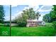 House's back and side yard with deck and detached garage at 17128 Towne Rd, Westfield, IN 46074