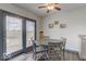 Kitchen dining area with gray table and four chairs, near sliding glass doors at 17128 Towne Rd, Westfield, IN 46074