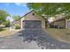 Attached garage with driveway and landscaping at 9728 Revere Way, Indianapolis, IN 46250