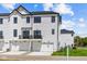 White two-story home with two-car garage and balcony at 7107 Pate Hollow Dr, Brownsburg, IN 46112