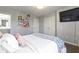 Spacious bedroom with a large TV and double doors at 14826 Braemar E Ave, Noblesville, IN 46062