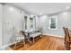 Bright dining room with hardwood floors and farmhouse table at 3916 N Capitol Ave, Indianapolis, IN 46208