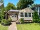 Beige house with a pergola and brick pathway at 3916 N Capitol Ave, Indianapolis, IN 46208