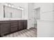 Elegant bathroom with double vanity and linen closet at 10611 Maidenhair Dr, Indianapolis, IN 46239