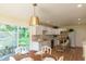 Modern white kitchen with stainless steel appliances and a breakfast bar at 6670 E 13Th St, Indianapolis, IN 46219