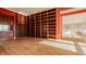 Spacious library with built-in wooden shelving and hardwood floors at 350 N Meridian St # 901, Indianapolis, IN 46204