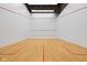 Indoor squash court with hardwood floor and white walls at 350 N Meridian St # 901, Indianapolis, IN 46204